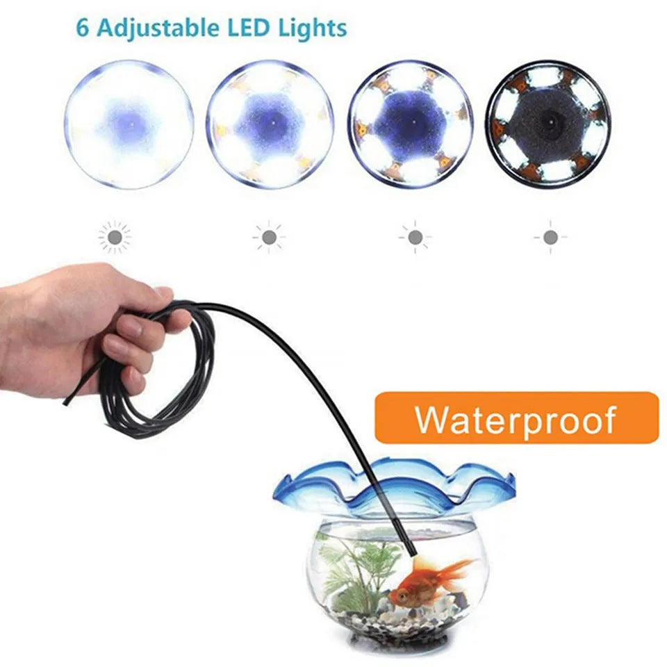Three-in-one USB endoscope with flexible cable, HD camera, side mirror, hook, and magnet attachments on a table.