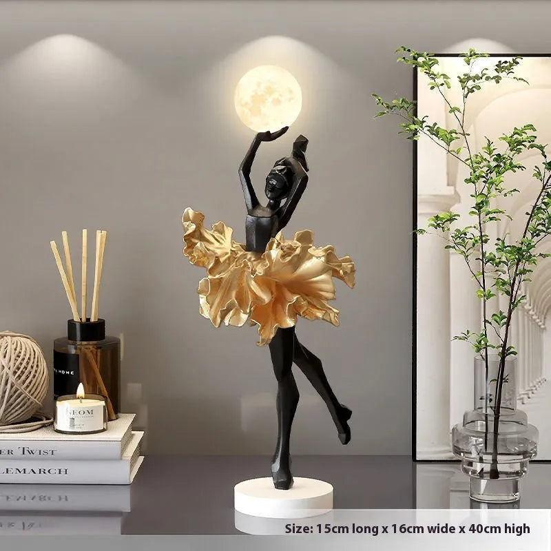 Small modern resin night lamp in black gold colour with USB charging cable.