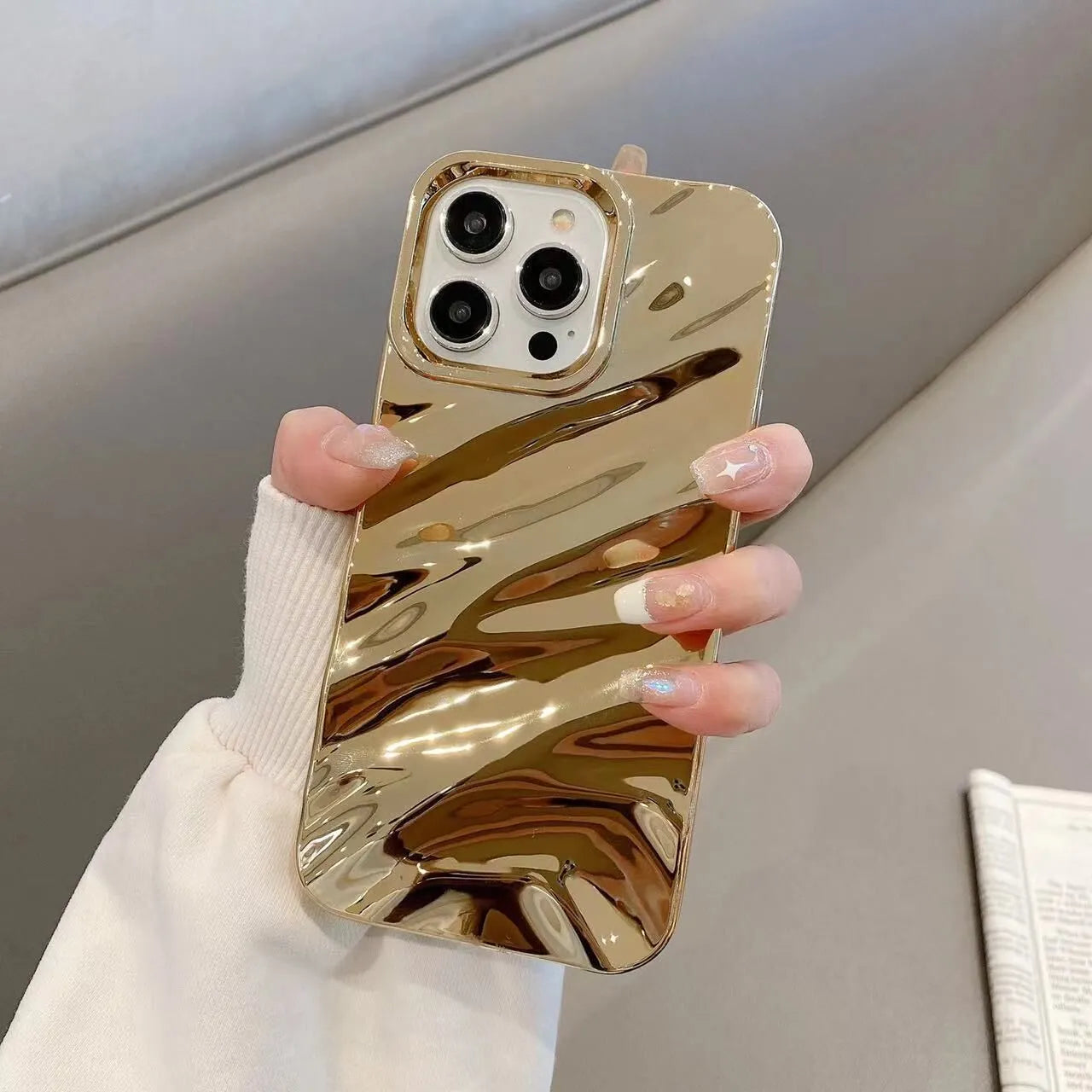 Soft wave pleated TPU phone case for Apple iPhone 17 in a selection of colours including electroplated gold and matte purple.