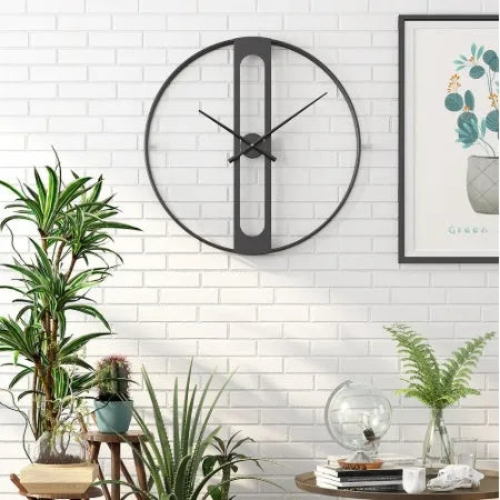 Large round metal wall clock with 50cm diameter in black or gold finish.
