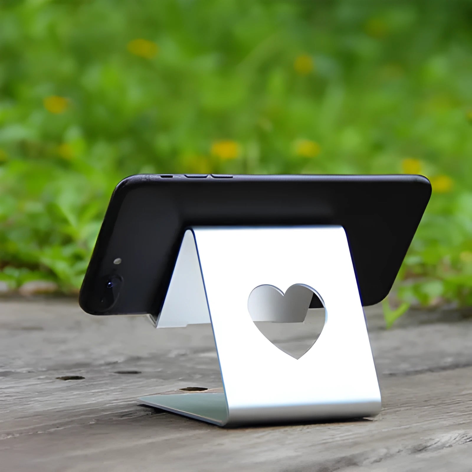 Aluminium alloy stand holding a tablet PC upright on a desk, black finish