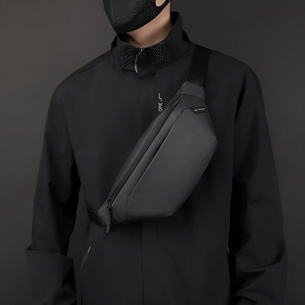 Outdoor casual sports crossbody bag in black nylon with stitching details, worn across chest