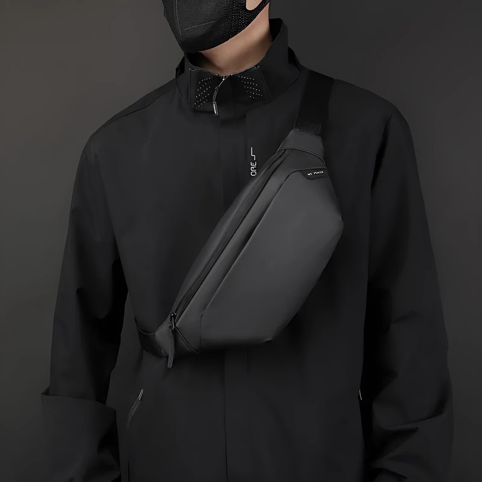 Outdoor casual sports crossbody bag in black nylon with stitching details, worn across chest