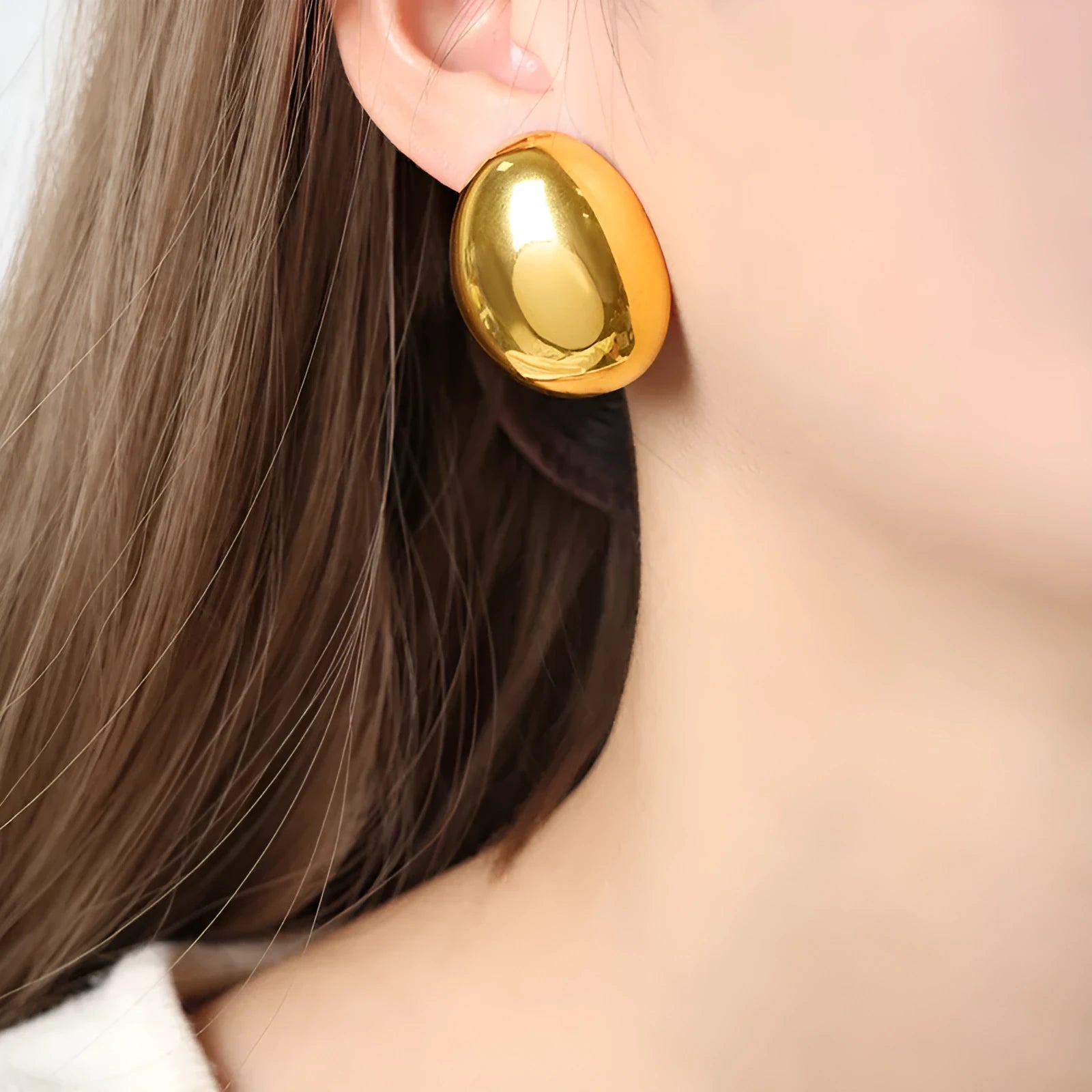 Geometric line earrings in stainless steel with 18K gold electroplated finish and glazed surface