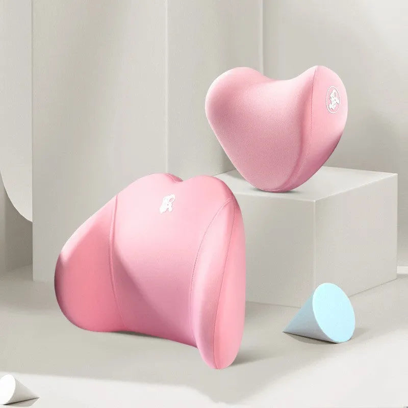Heart-shaped car pillow in choice of colours, shown as headrest and lumbar support on a car seat.