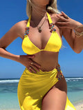 Women's three-piece swimsuit set with bikini top, pants, and matching skirt in solid colour