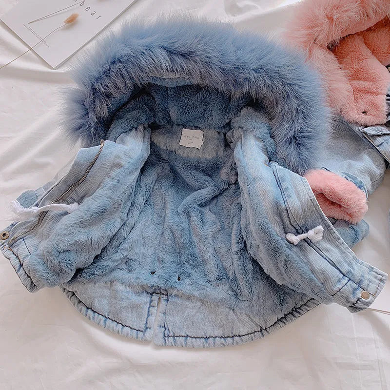 Blue denim coat for a young girl with a fleece lining and a non-removable hood.