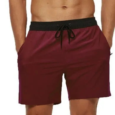 Men's blue running shorts with zipper pocket and drawstring waist detail for fitness activities