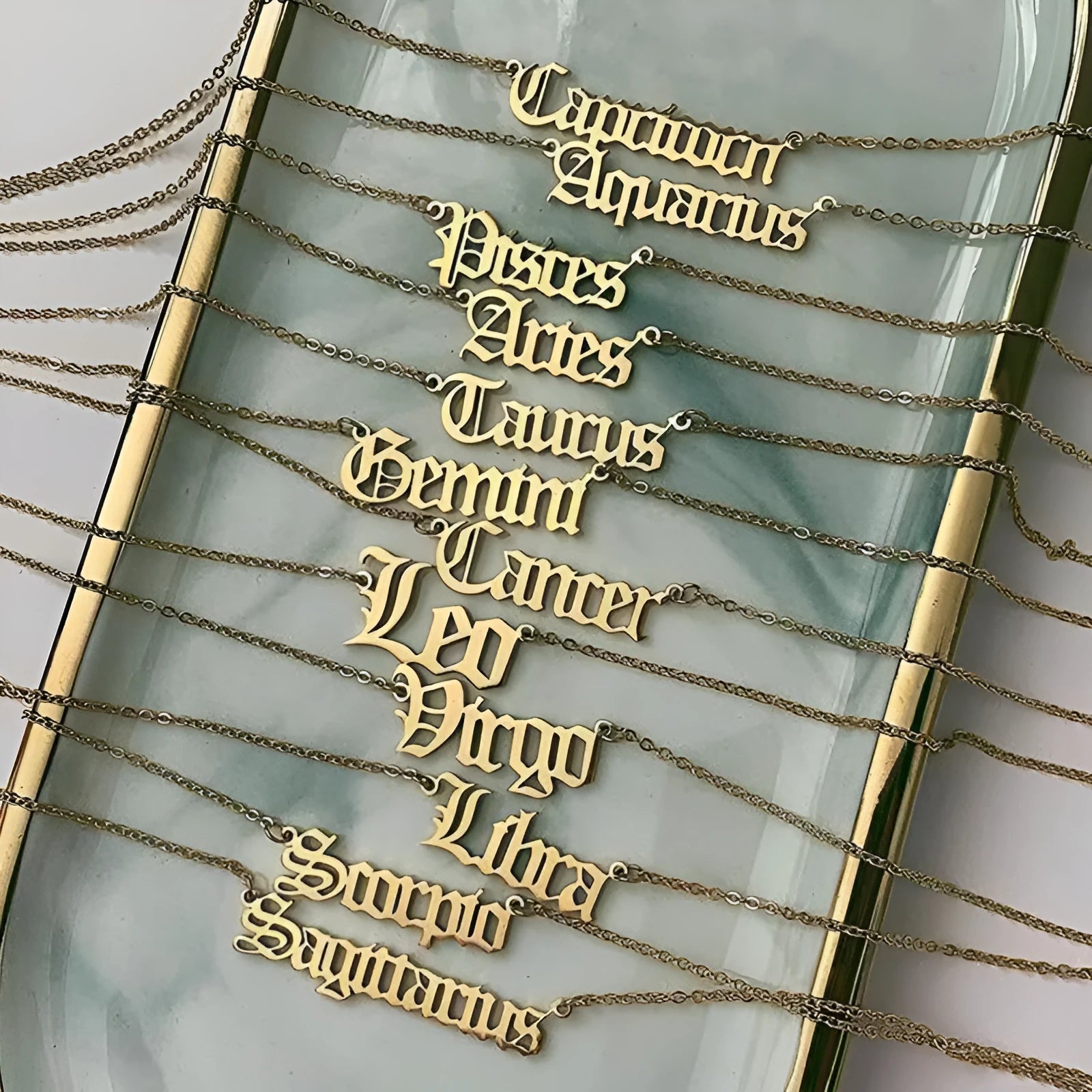 Zodiac Old English pendant necklace in alloy, showing astrology sign in classic font, lightweight jewellery