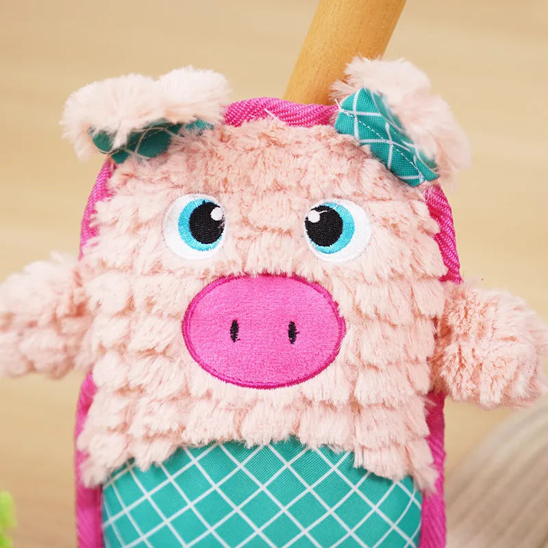 Blue bite-resistant stuffed dog toy with squeaker, safe for molar teeth, next to green and pink versions.