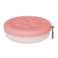 Portable plastic dog bowl for food and water, shown in light pink and light green two-colour design.