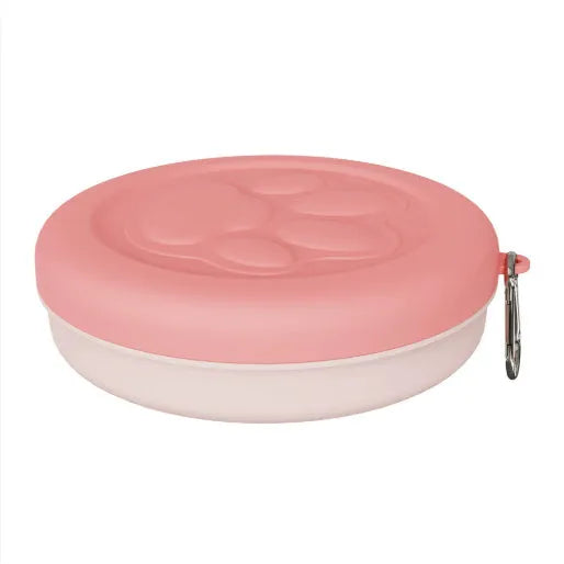Portable plastic dog bowl for food and water, shown in light pink and light green two-colour design.