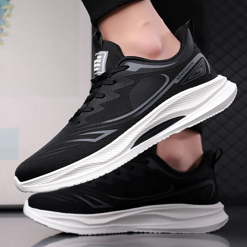 Men's low-top casual shoe in grey mesh with a round toe and light rubber sole.