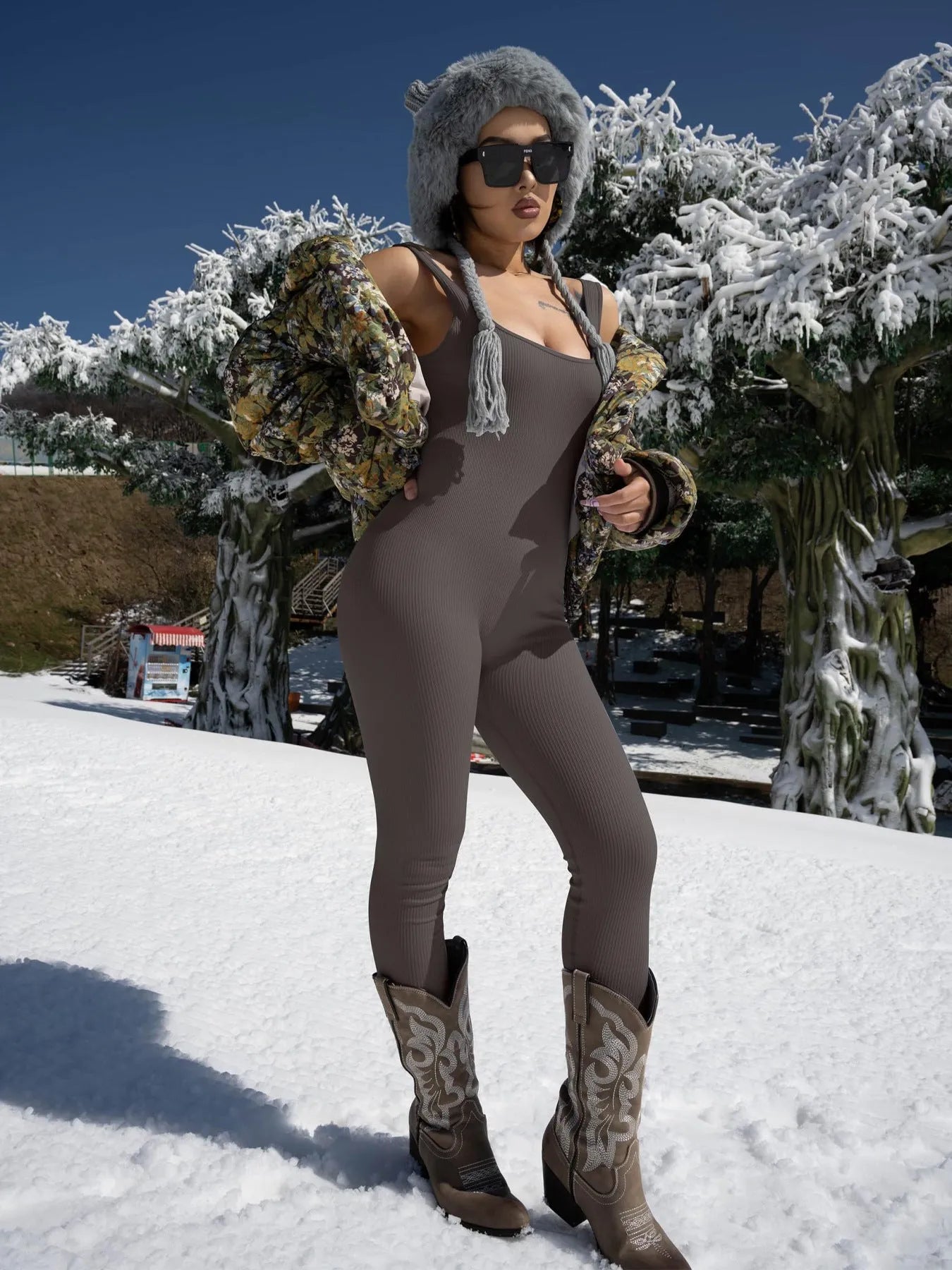 Women's long sleeve spandex suspender tank top tights bodysuit on a hanger