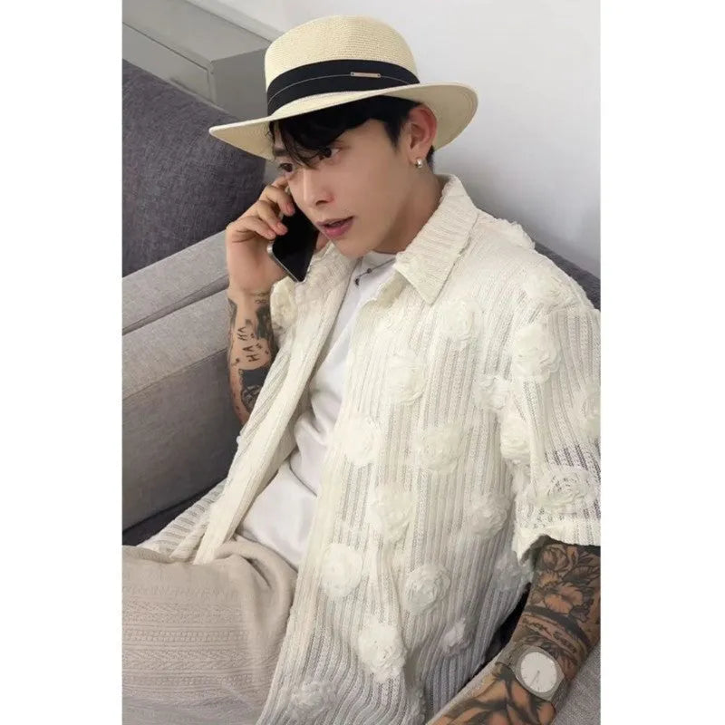 Man's loose-fit short-sleeve shirt with a white and black three-dimensional floral print on heavyweight fabric.