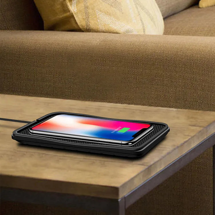 Black anti-slip car wireless charger compatible with Apple iPhone, 175x93x14mm, placed on car dashboard