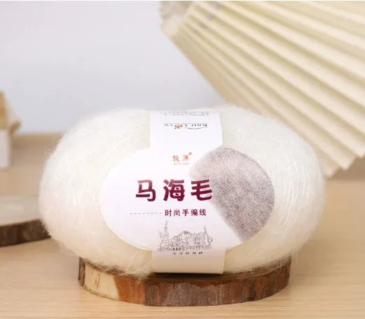A ball of mohair wool for DIY hand-weaving a scarf in the Inverness thread style, with 34 colour options.