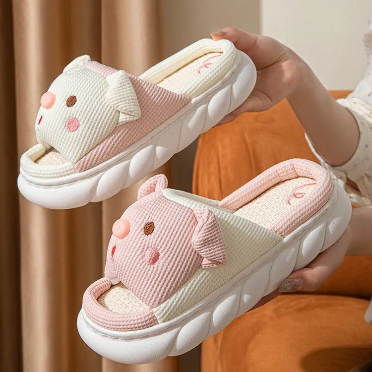 A pair of open-toe linen flip flop slippers for couples, shown in a choice of colours with a cushioned footbed.
