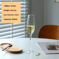 Set of clear champagne flute glasses showing seven different crystal-inspired design variations