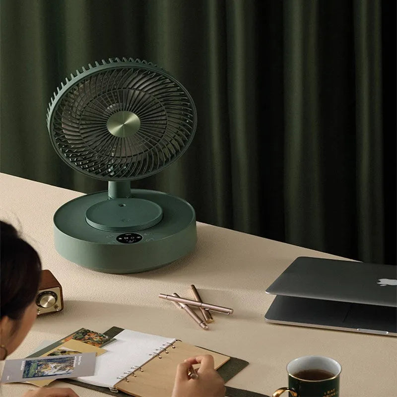 Green telescopic storage floor electric fan shown in both desktop and extended vertical configurations with remote control