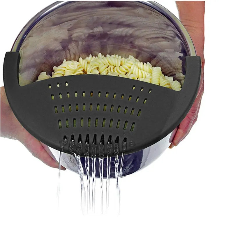 Black silicone food oil drainer clipped onto a pressure cooker liner for draining liquid