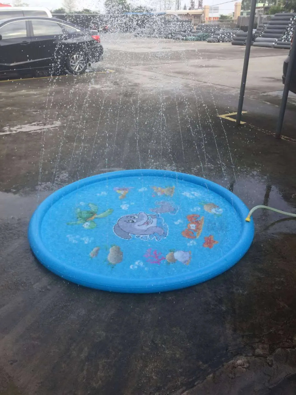 Blue PVC children's water spray play mat with marine animal designs measuring 100x170cm