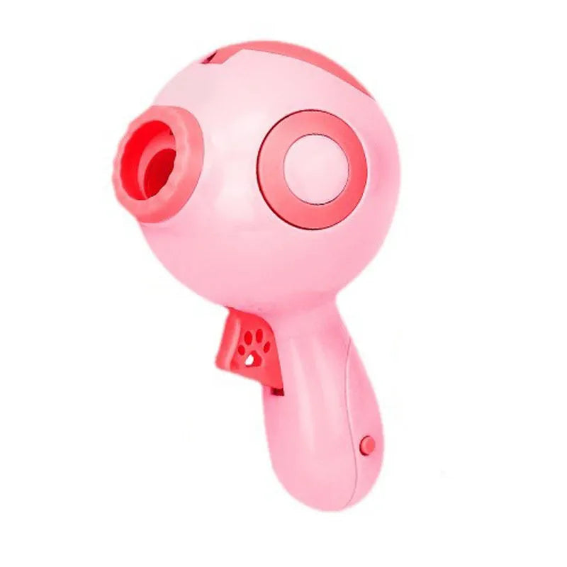 Green, orange, and pink manual dog treat launcher toy for interactive play and slow feeding.