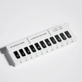 Black and white plastic piano-shaped temporary parking sign with 'Piano Stop' text.