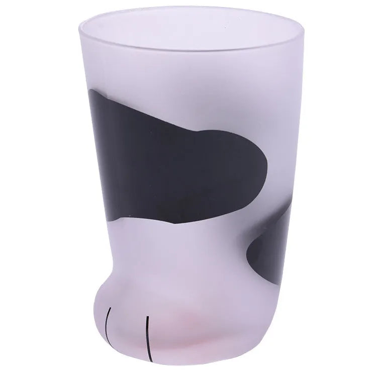 Creative cat paw shaped glass mug with 300ml capacity and frosted texture on a desk