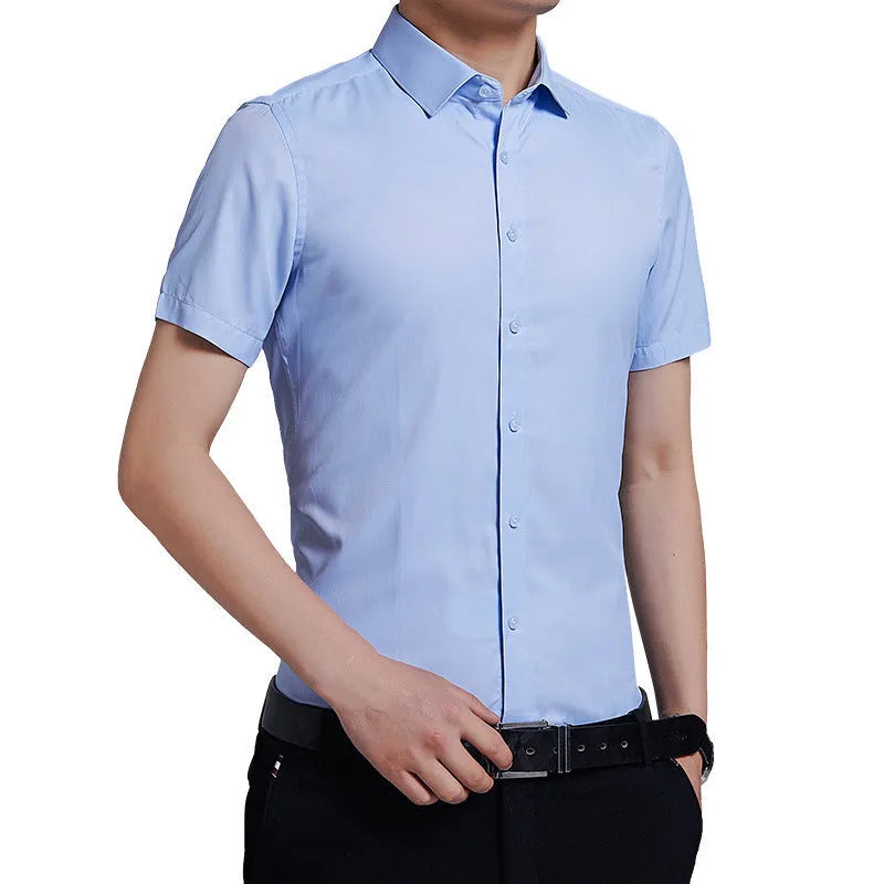 Men's solid colour non-iron short sleeve shirt in white, black, light blue, and pink, loose fit cotton polyester blend