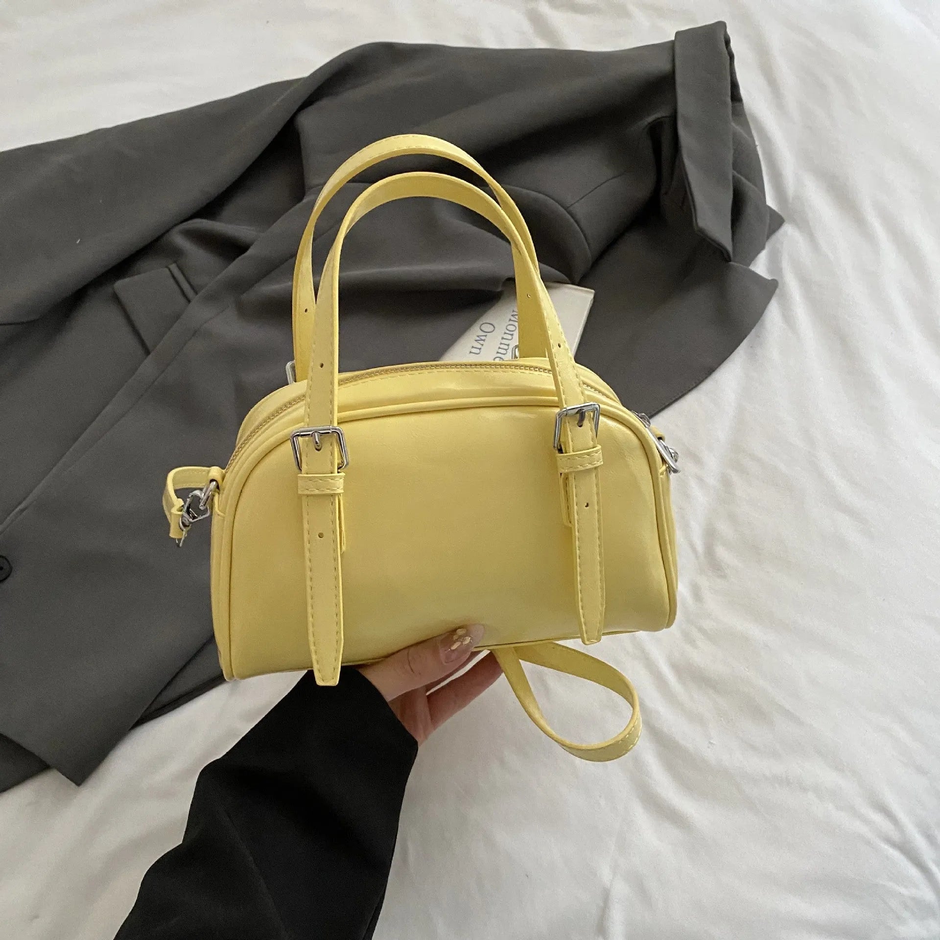 Soft black PU leather Korean-style shell-shaped women's shoulder bag with a pendant.
