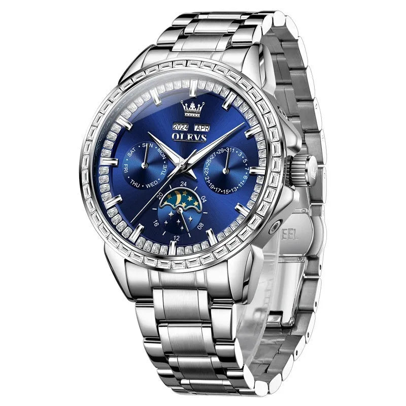 Men's stainless steel automatic mechanical watch with a blue dial and butterfly clasp on a wrist.