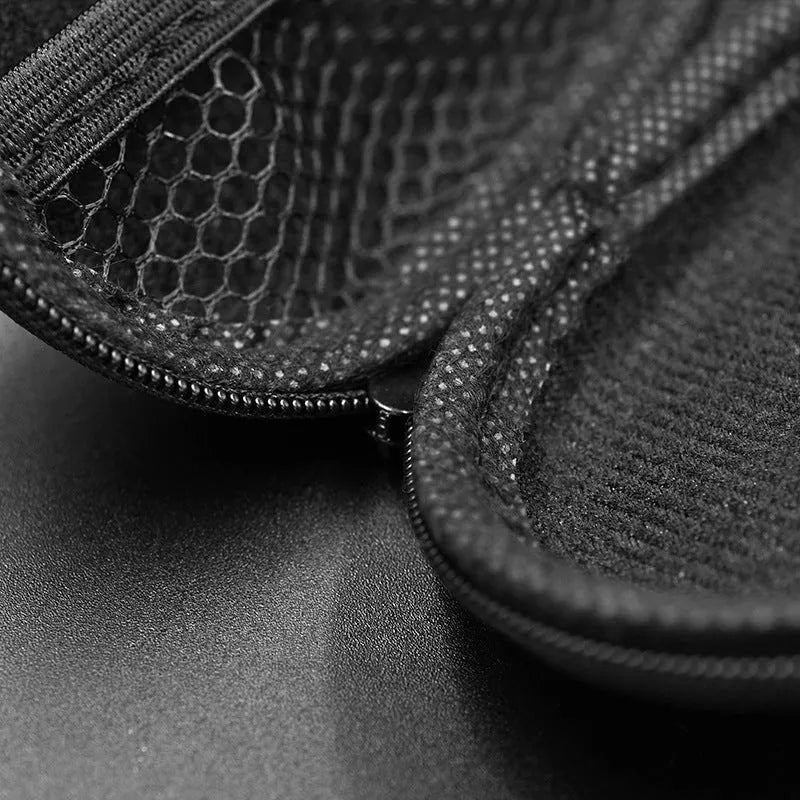 Black soft leather oval-shaped earphone storage bag.