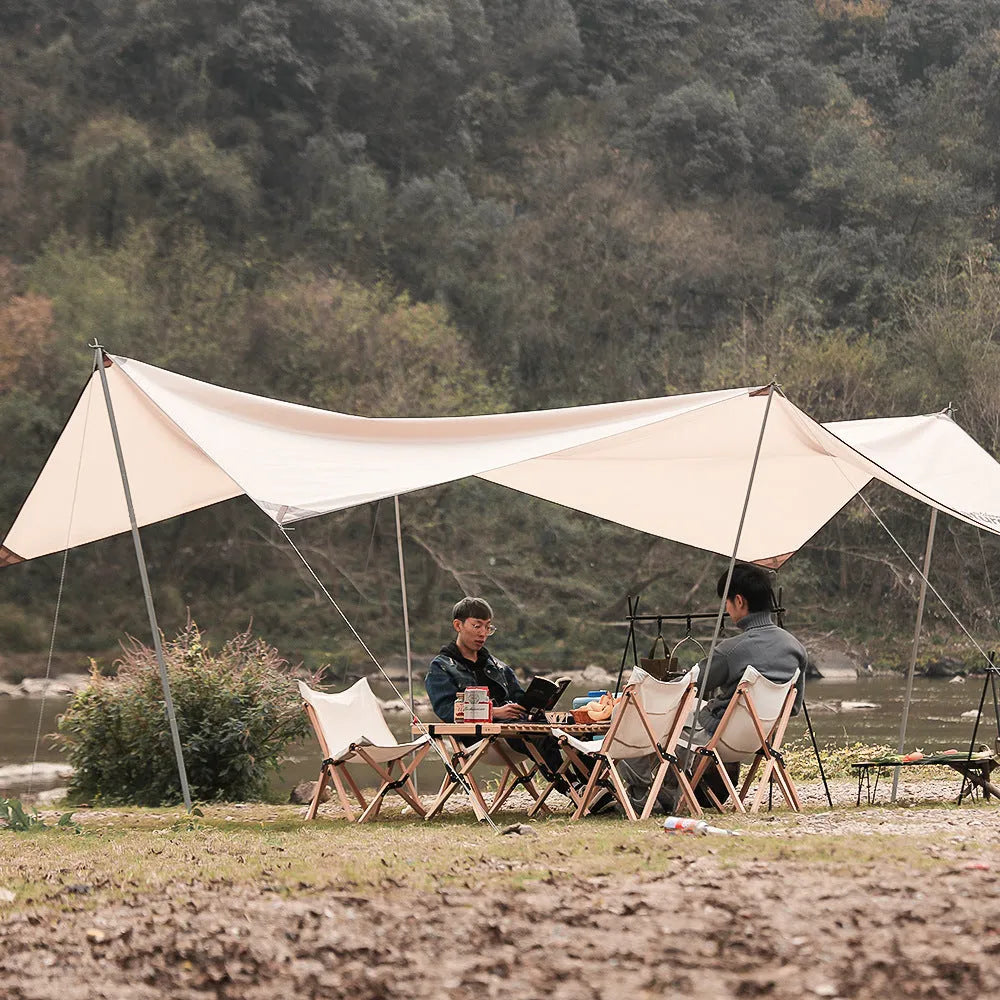Aluminium alloy portable folding clothes drying rack with triangular frame and top tray, set up outdoors.