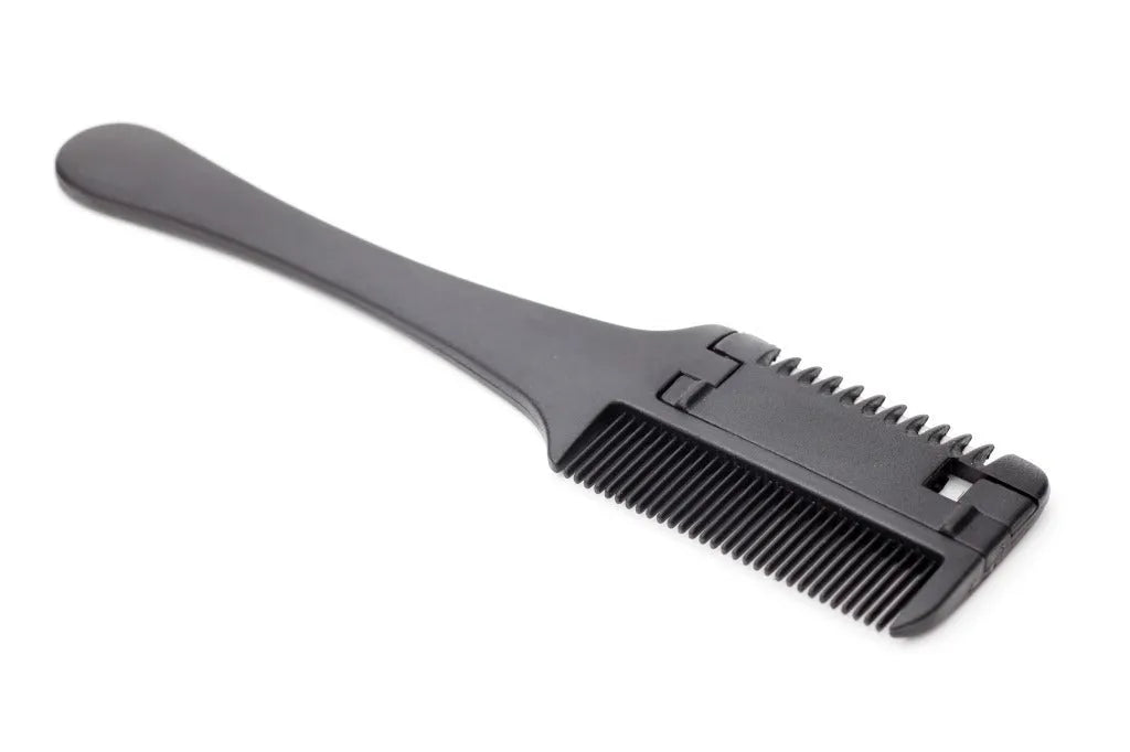 Pet razor comb and brush tool for dogs and cats with spare blades on a white background.