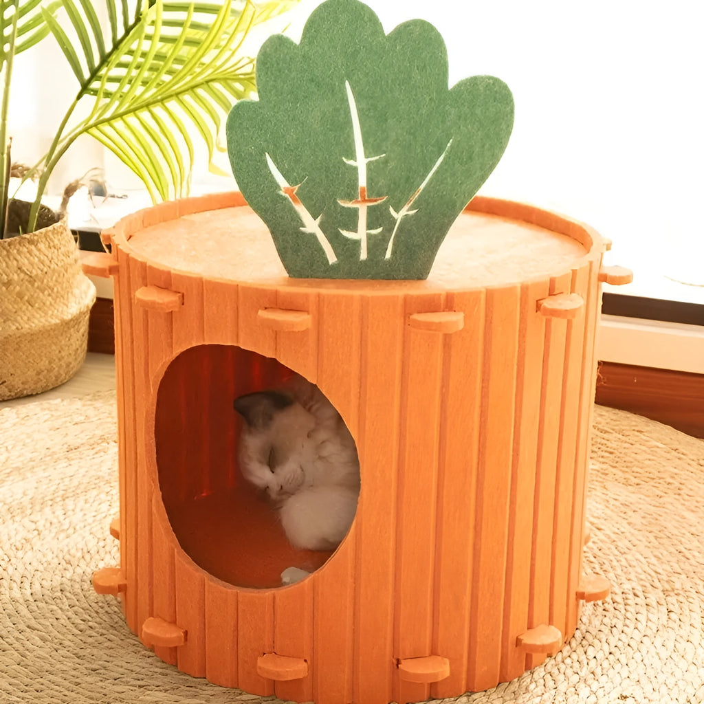 Carrot-shaped grey felt cat bed with a round tunnel entrance, shown next to a cat.