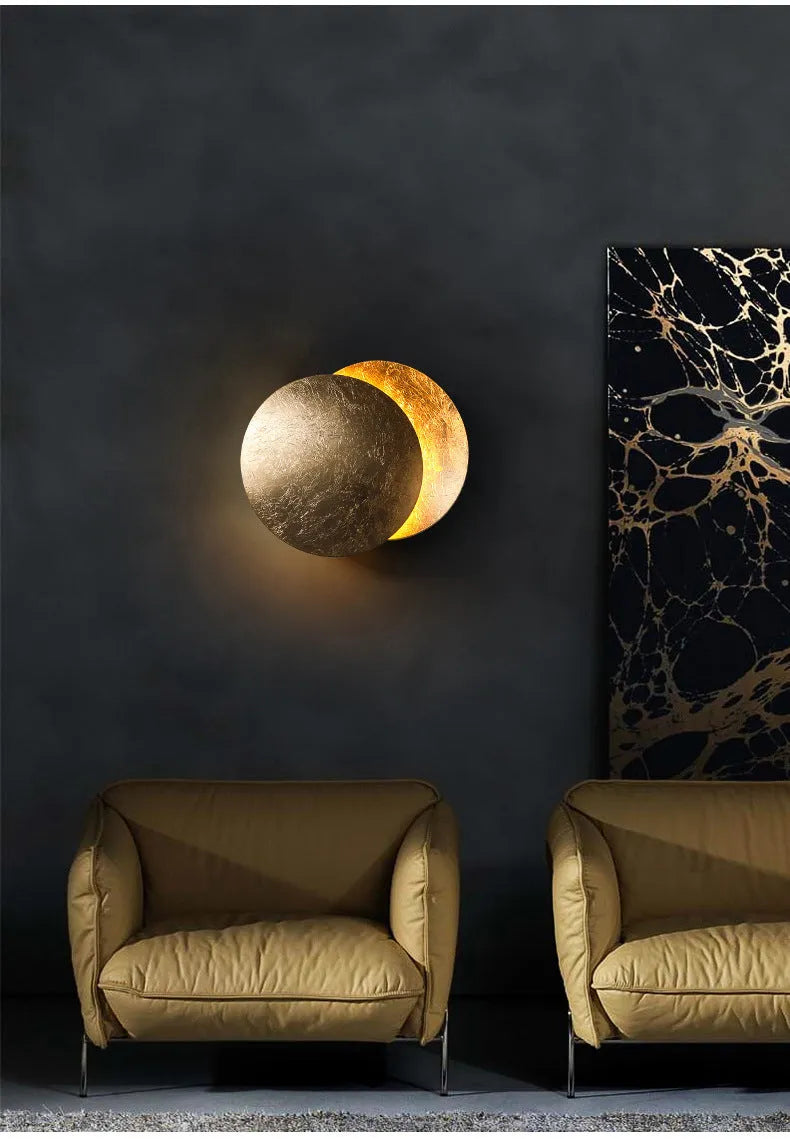 Modern minimalist aluminium bedside lamp in gold and black, shown in 20cm and 25cm diameter options.