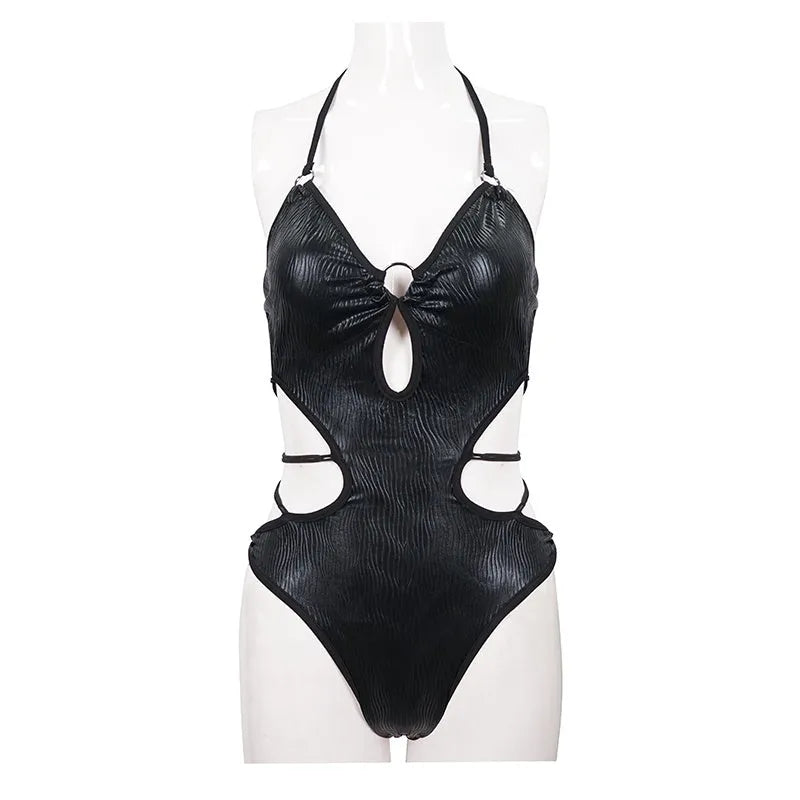 Black triangle one-piece backless swimsuit with gather detailing and wireless cup, on display