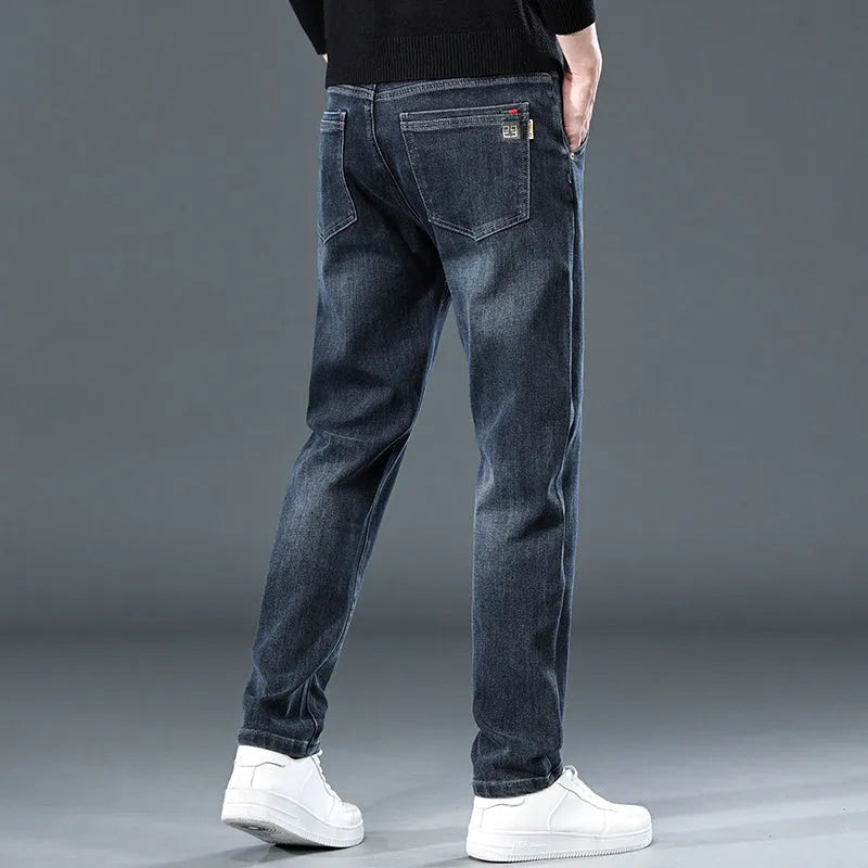 Blue grey slim straight casual trousers with elastic waist and zip fly on hanger