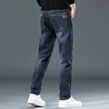 Blue grey slim straight casual trousers with elastic waist and zip fly on hanger