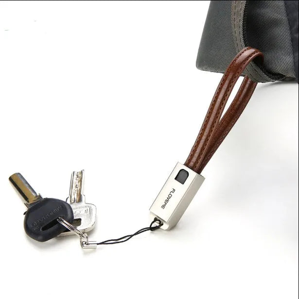 Short 20cm black leather USB to Apple Lightning charging cable with zinc alloy connector.