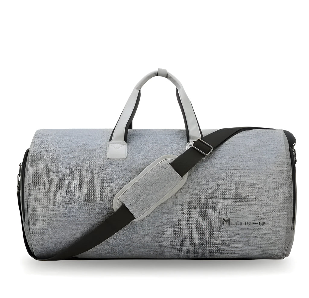 Travel garment bag in black and gray with adjustable shoulder strap, hanging suit carrier, and multiple pockets on a neutral background
