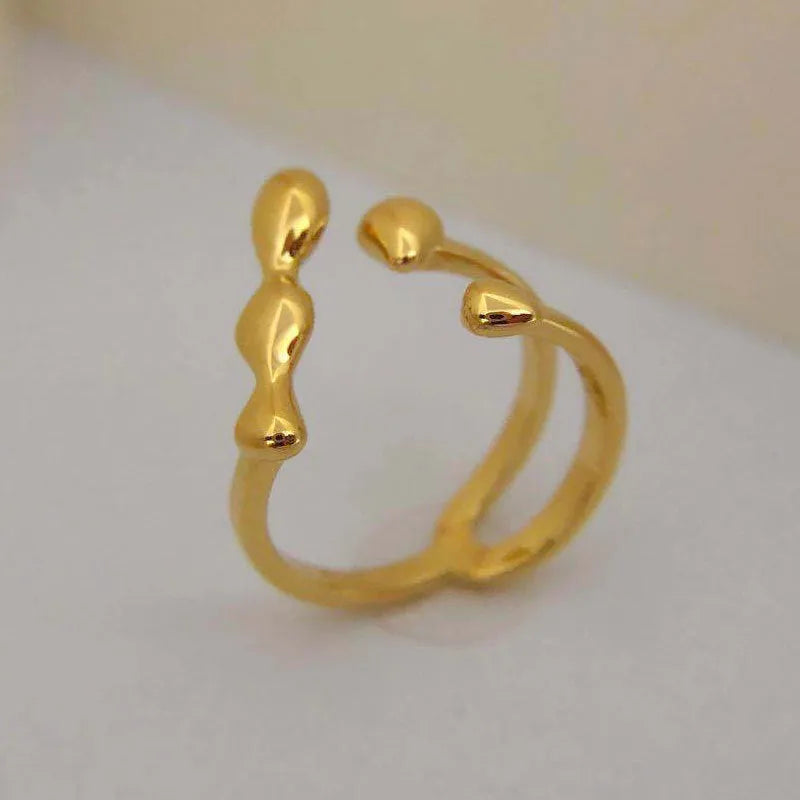 Brass spherical ring for women in gold or silver plating.