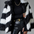 Black and white contrast lapel faux fur coat with a fur collar, shown on a model.