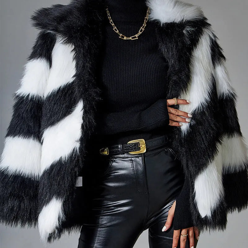 Black and white contrast lapel faux fur coat with a fur collar, shown on a model.