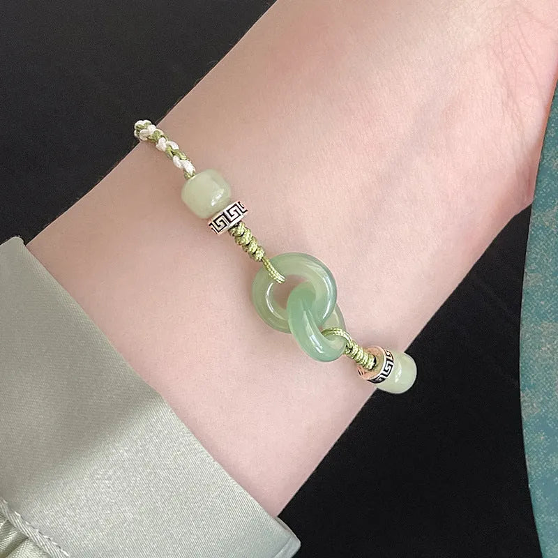 Green jade and copper ethnic bracelet with peace buckle centrepiece and double ring design