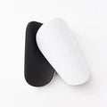 Two pairs of PU mini shin guards in assorted colours on a white background.