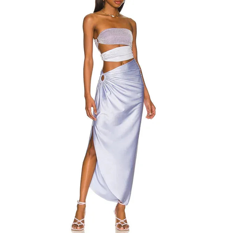Purple women's one-piece swimsuit with a matching wrap skirt on a model, showing the quick-dry fabric and tight fit.