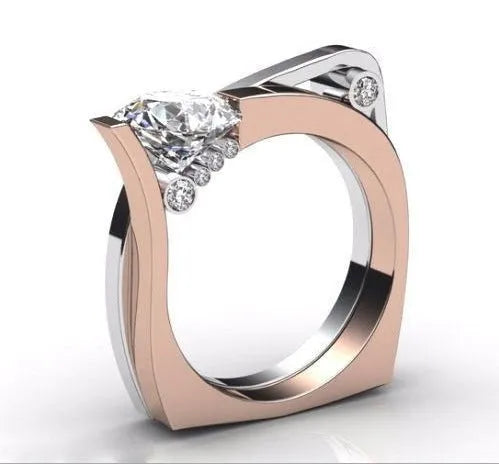 Geometric rose gold alloy couple ring with inlaid zircon stone on a grey background.