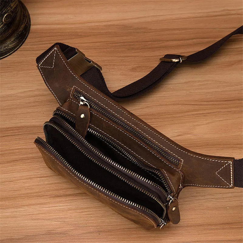 Brown men's cowhide sports waist bag shown from the front, highlighting the pull closure and compact 30cm wide design.